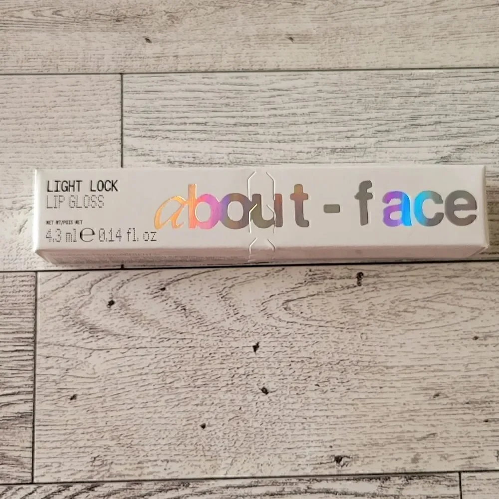 About Face Light Lock Lip Gloss in Angel on Fire